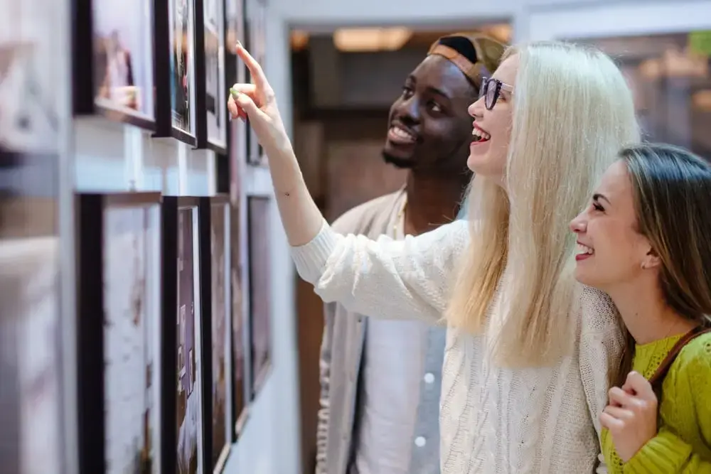 Friends looking at photo frames