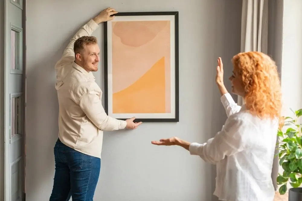 Man holding picture frame