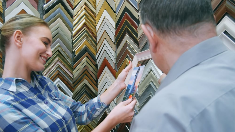 Woman shopping for custom art frame