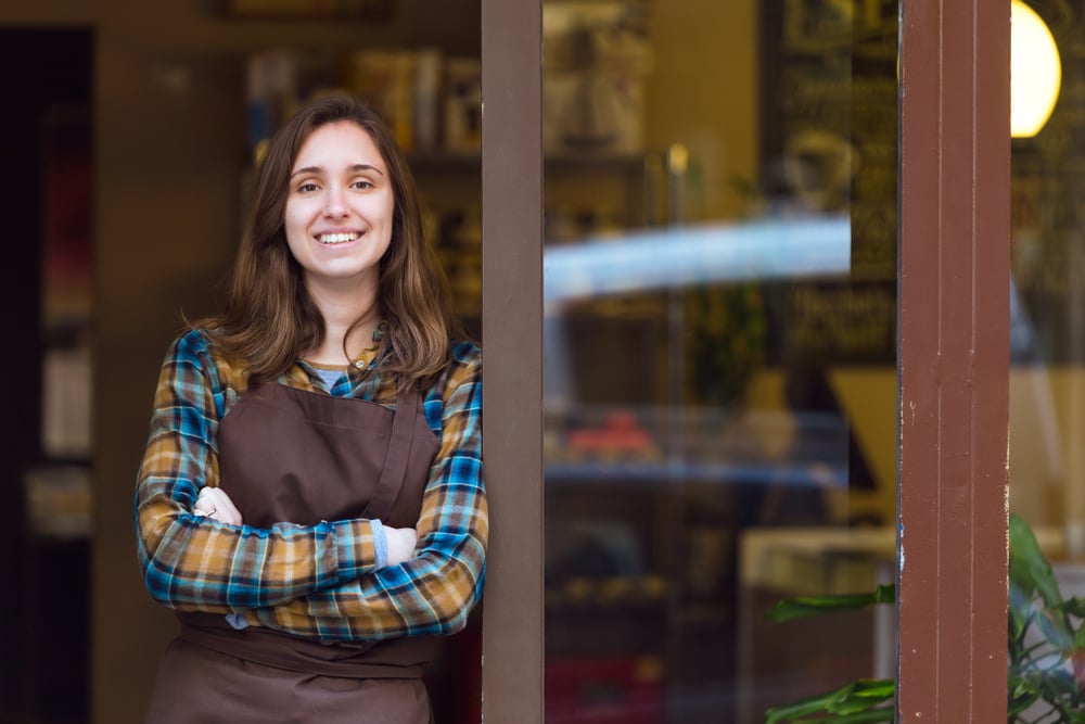 Woman outside frame store